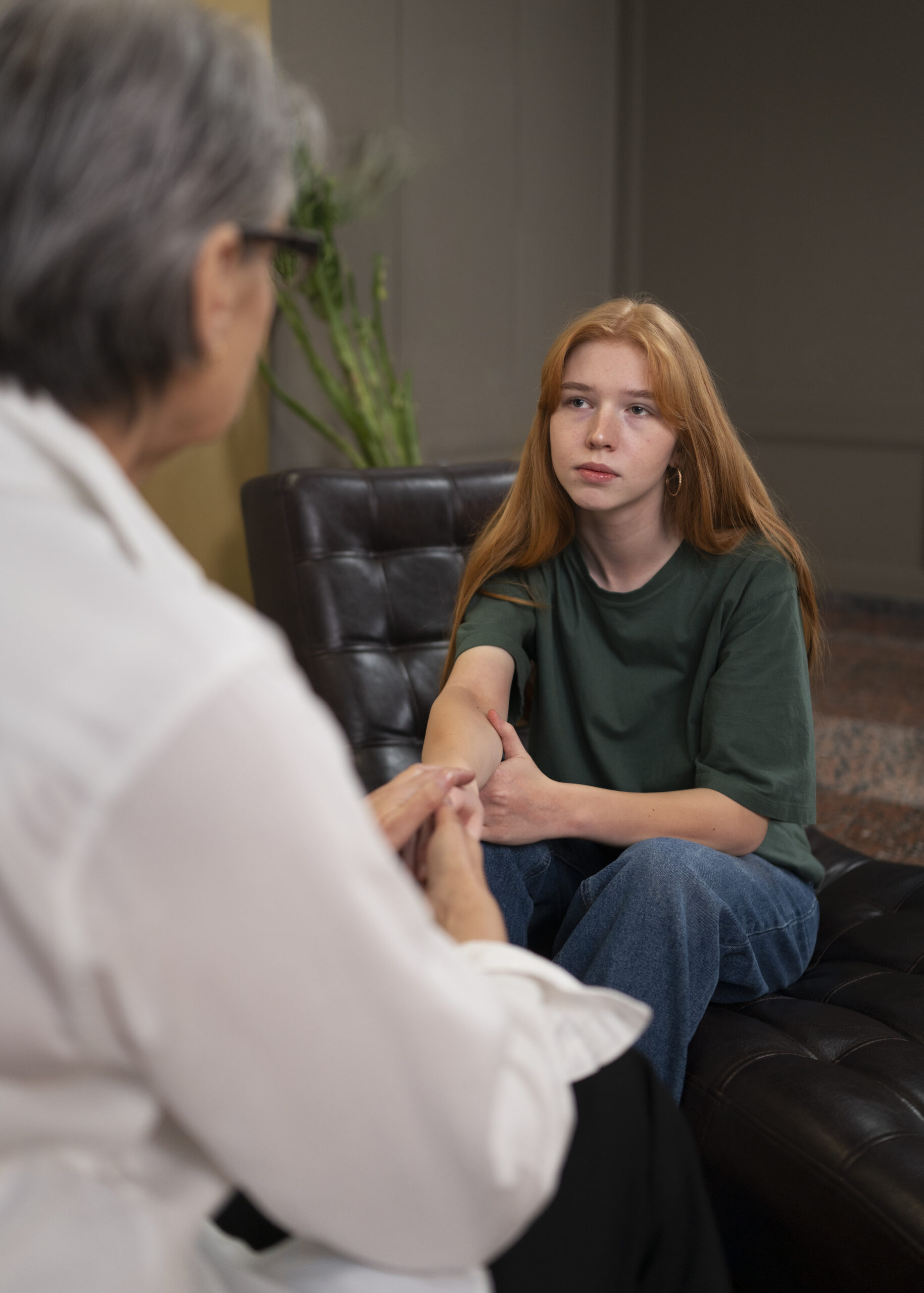 A person in a calm first online therapy session, talking with their therapist