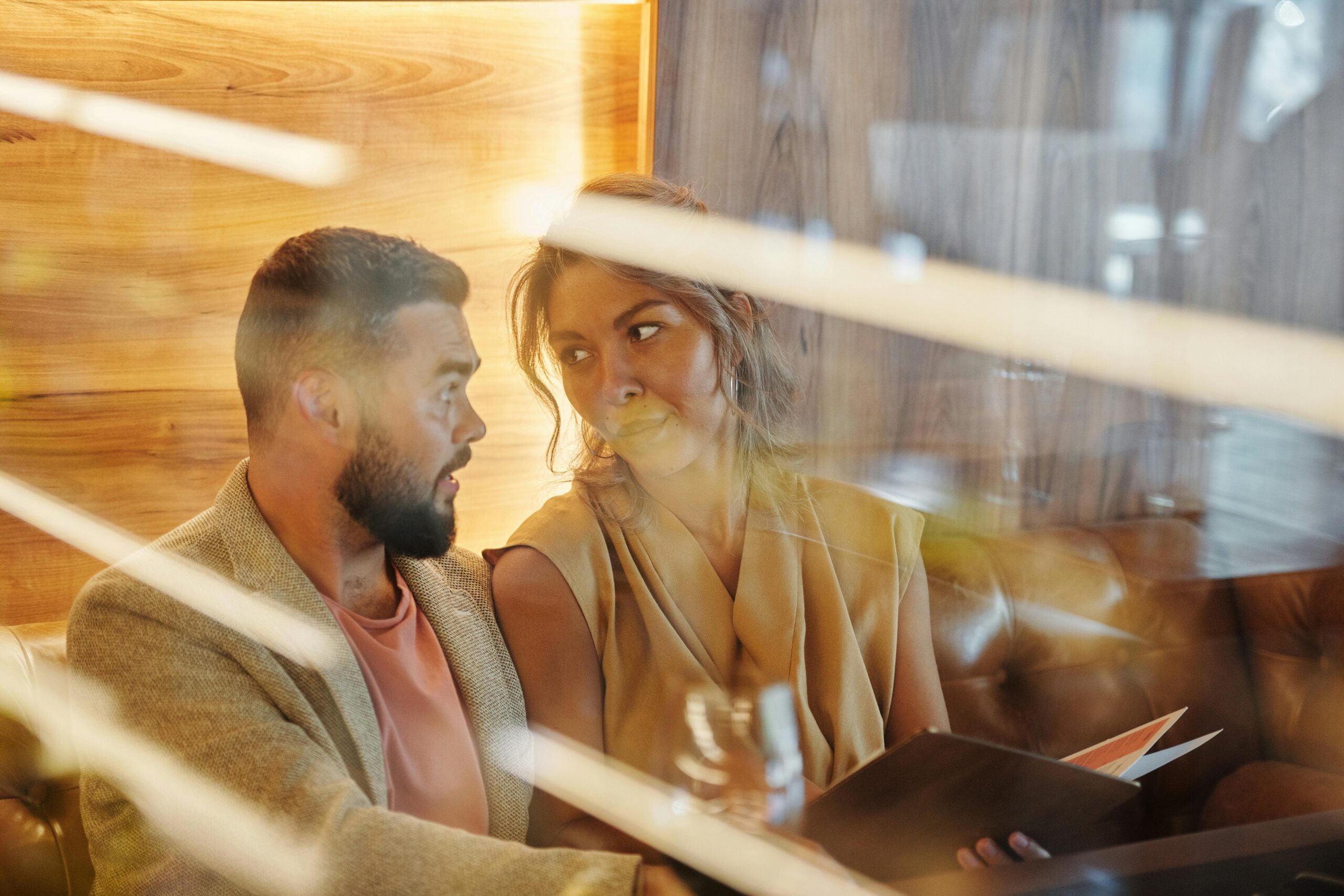 A person sitting quietly, carrying private, looping doubt about their relationship.