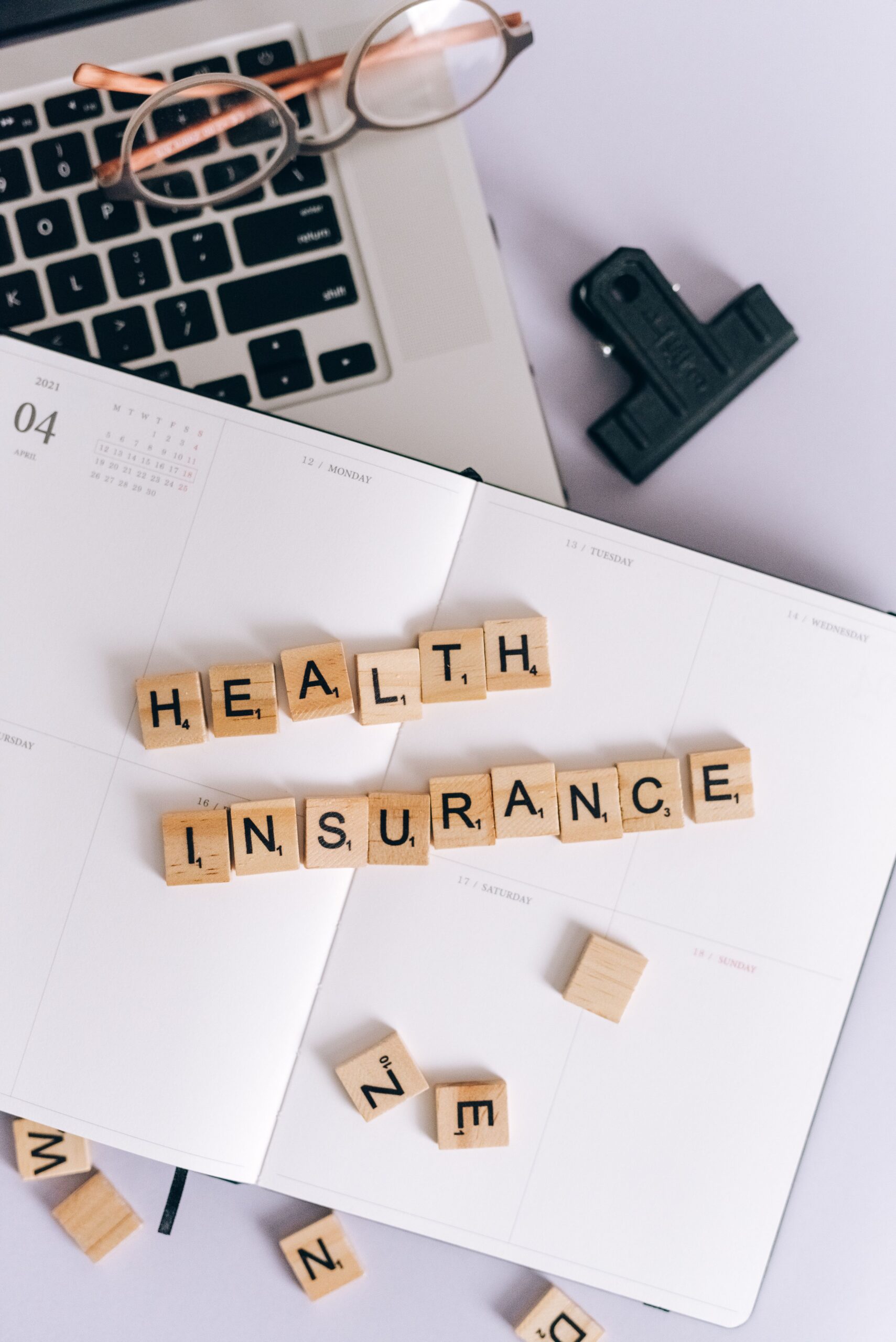 Letter tiles spelling out the words health insurance