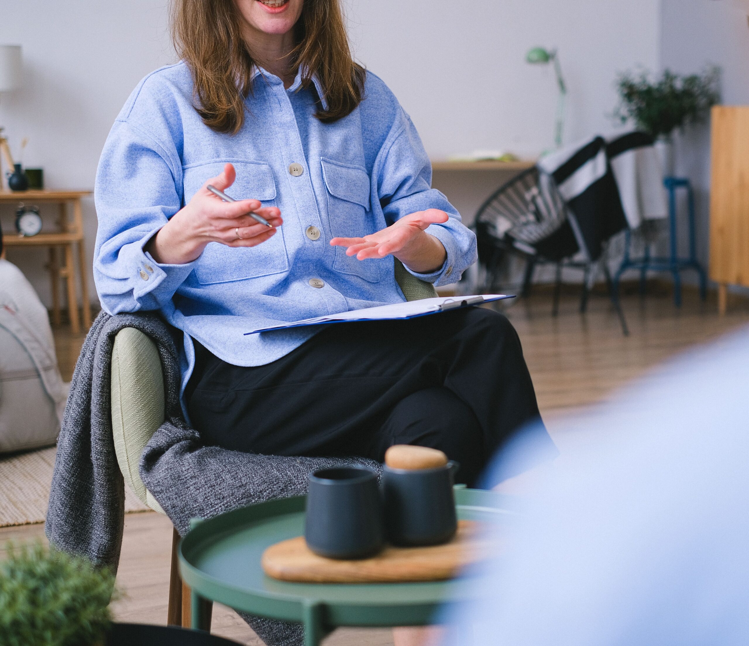 A supportive therapy session between a client and a therapist.