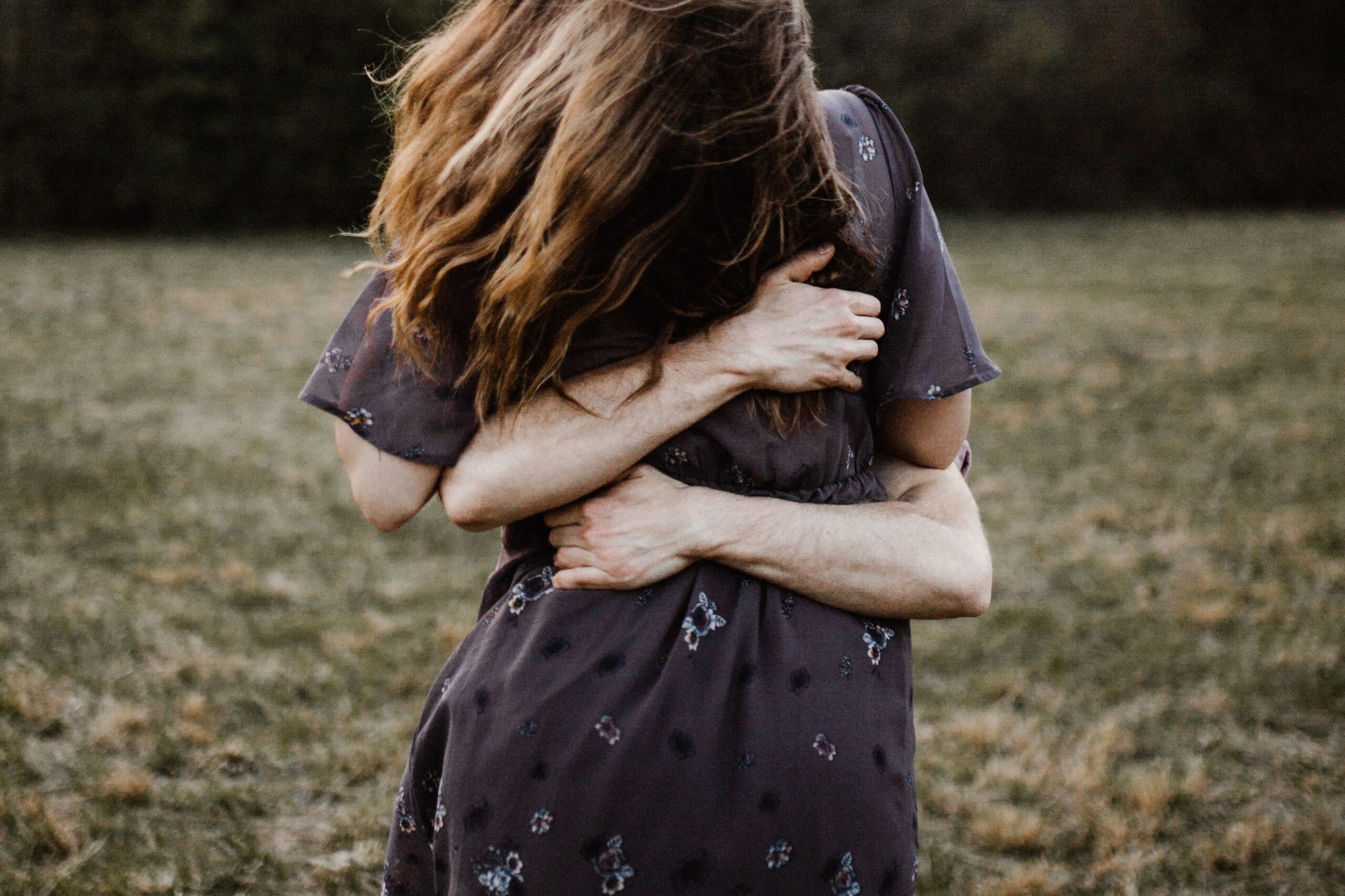 Two people embracing, conveying support and connection