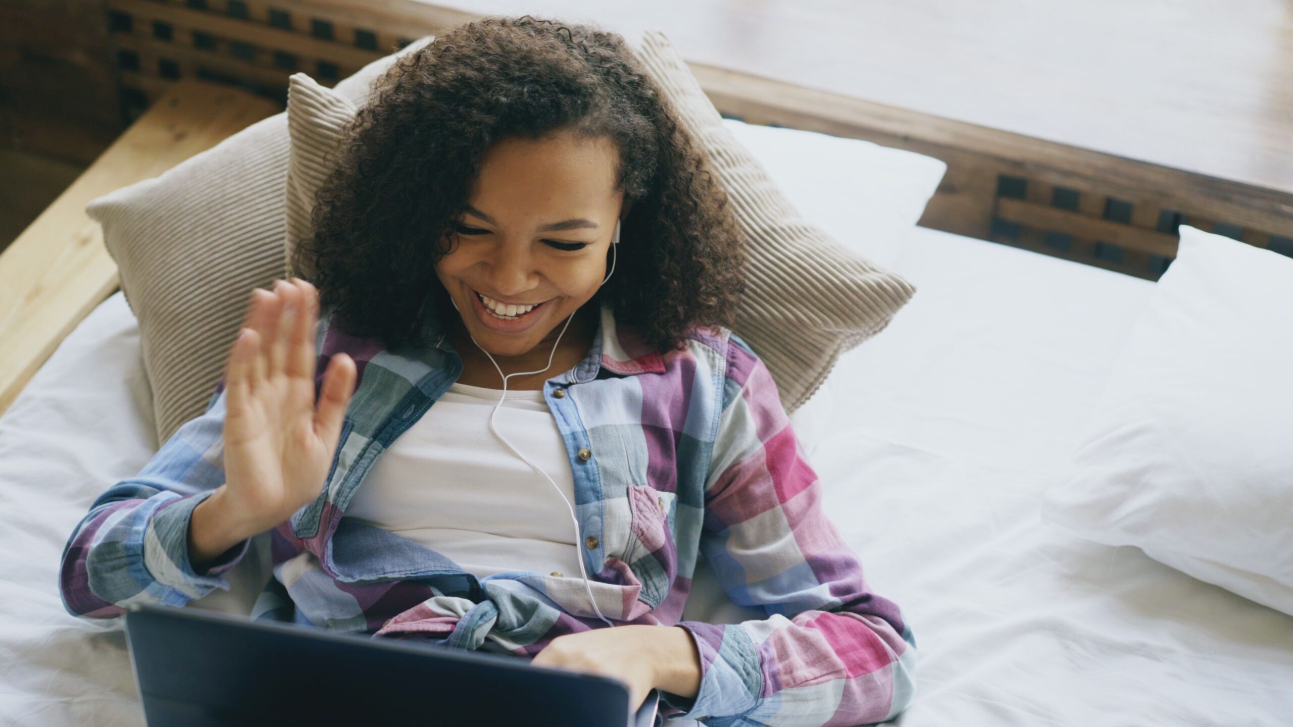 A woman on an online therapy video call from home